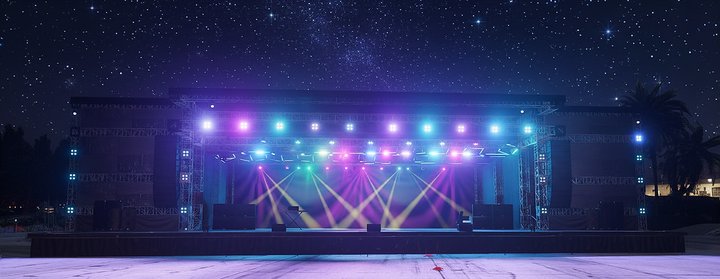 Large package — festival-grade stage with full lighting design under a starlit sky